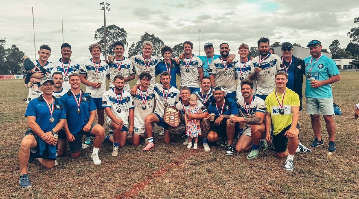 The Bulldogs celebrate their Batemans Bay Monaro Knockout grand final win over Avondale, claiming the Men's Tackle Cup 16-4. Picture supplied