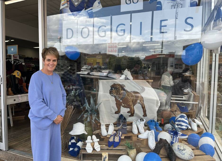 Lesley Schafer alongside the storefront she helped to decorate in Merimbula. Picture by James Parker