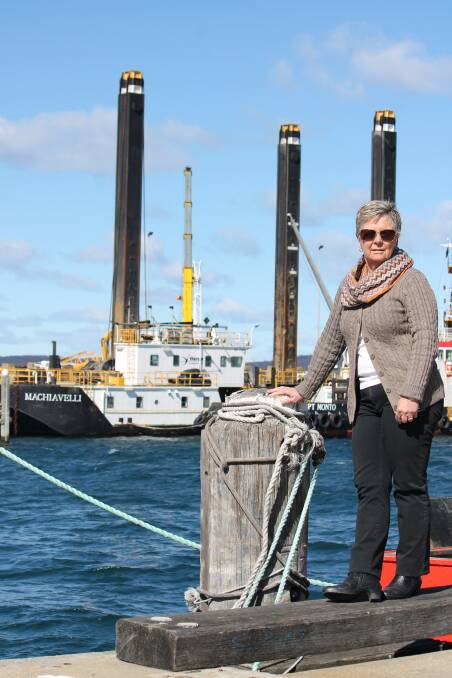 MILESTONE: Eden Chamber of Commerce president Jenny Robb welcomes the dredge 'Machiavelli', marking the long-awaited start of wharf extension. Picture: Liz Tickner