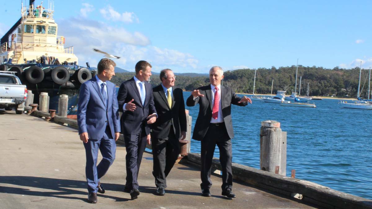 Prime Minister Malcolm Turnbull with his political colleagues Andrew Constance, Mike Baird and Peter Hendy on the wharf at Eden on Monday. Picture: Liz Tickner 