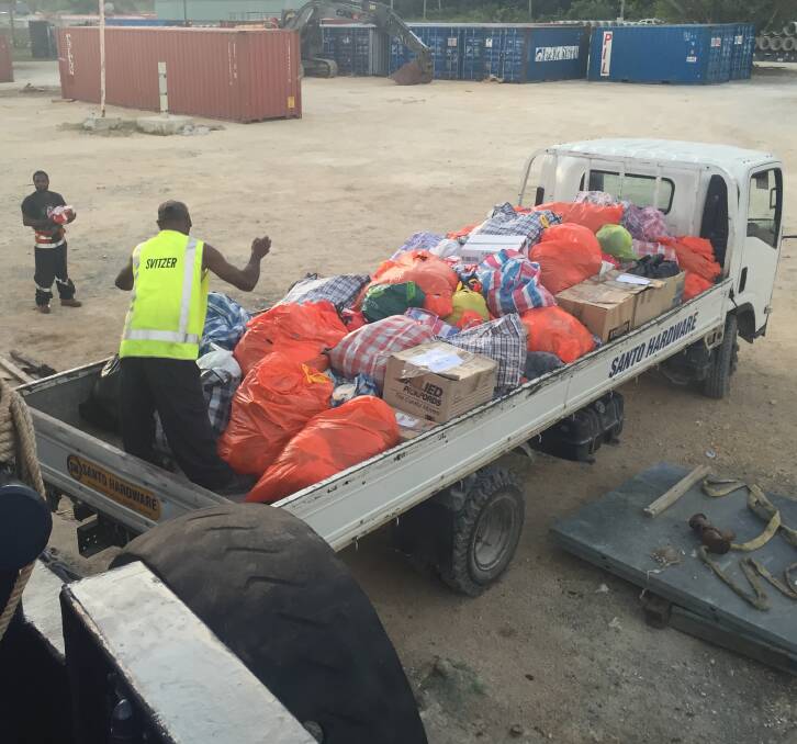 HELPING HAND: Donations from the people of Eden to Vanuatu's cyclone victims are loaded onto a truck, ready for distribution. Picture: Sean Griffin
