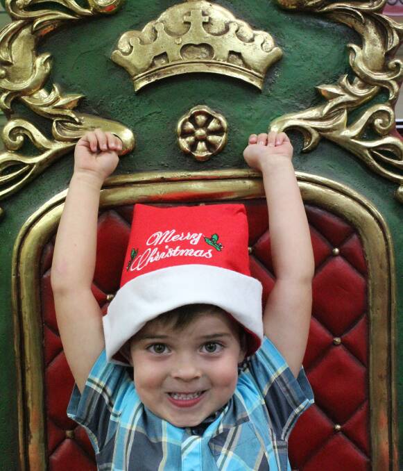 SANTA'S LITTLE HELPER: Trae Harrison, 4, of Fern Bay, is visiting Eden with his parents, former Eden residents Guy and Terra Harrison, in the lead up to Christmas. Picture: Liz Tickner