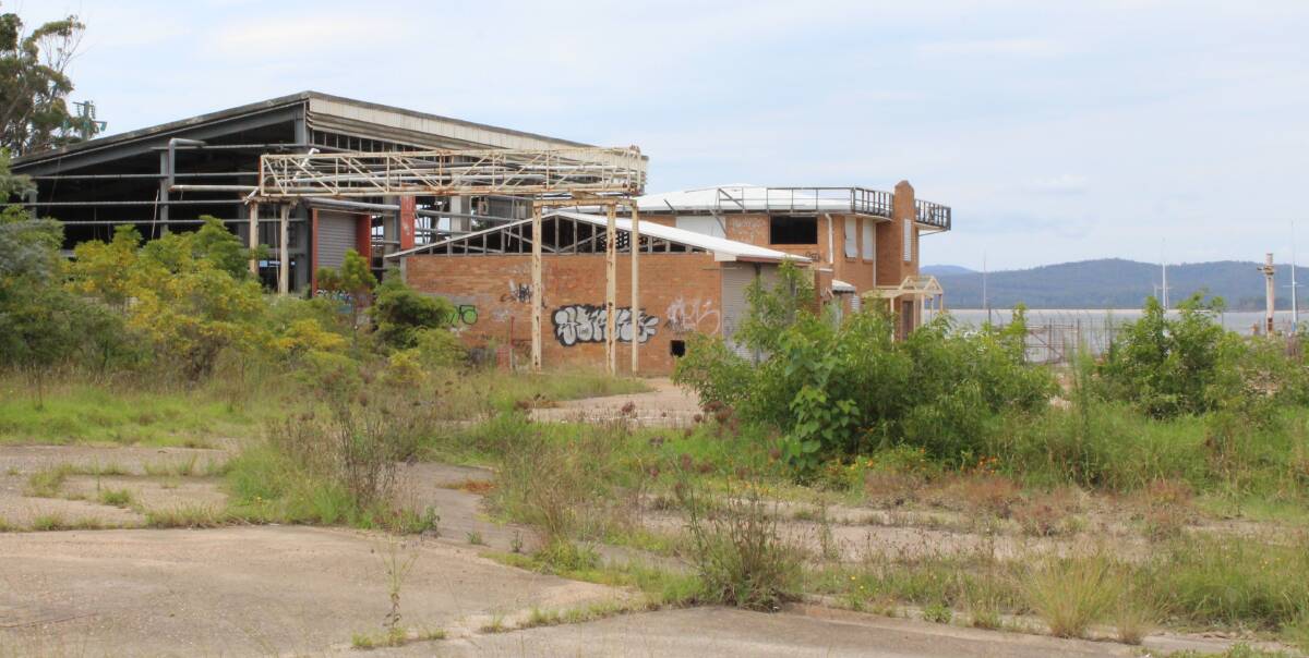 GOING, GOING: Dilapidated buildings at Eden's old cannery at Cattle Bay are to be demolished. The structures are known to contain asbestos. A new marina is planned for the site. Picture: Liz Tickner 