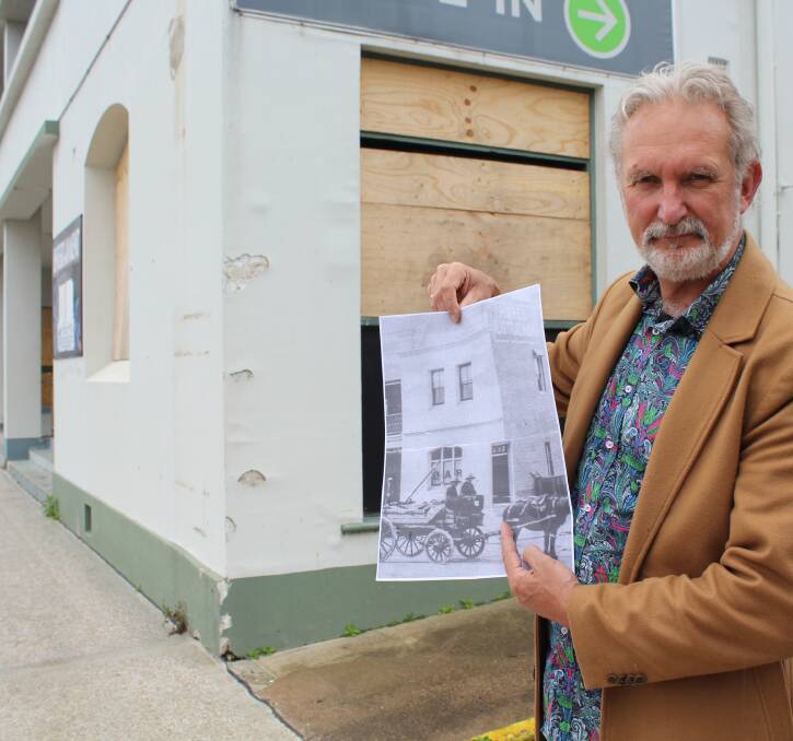 VISION: Eden’s Australasia president Peter Whiter holds a copy of a 1910 photo depicting the corner door of the old hotel. Picture: Liz Tickner  