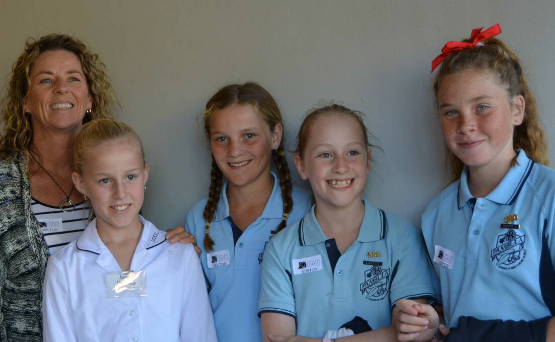 OPEN DAY: Lumen Christi Catholic College students Mia Hoffman and Jessica Holloway showed visitors through the school during its annual open day on May 4.