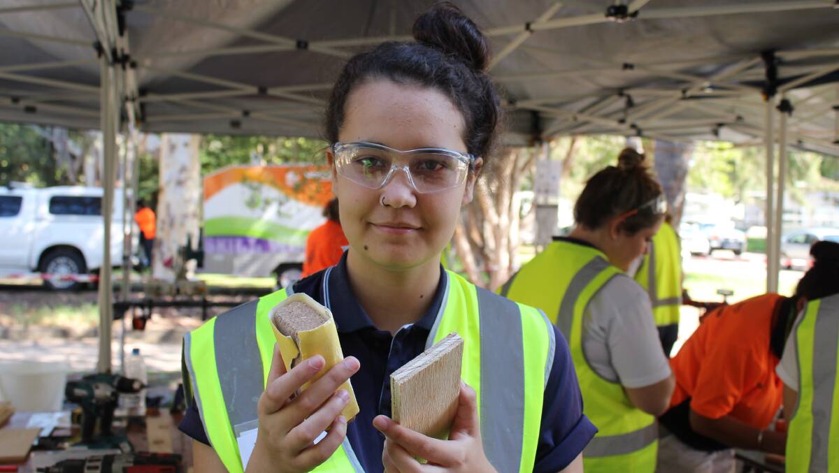 NEW SKILLS: Eden Marine High School student Nikai Stewart, of Eden, sandpapers a piece of wood before constructing a cutlery caddy at SALT's try-a-trade workshop for girls on Monday. Pictures: Liz Tickner  
