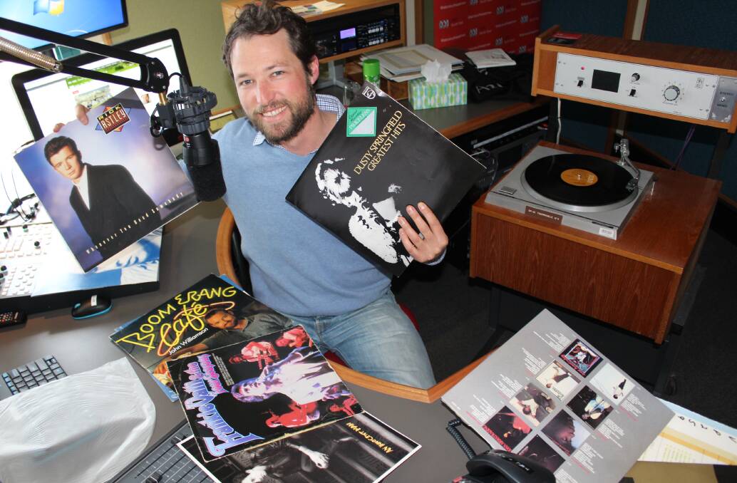 ABC breakfast presenter Simon Lauder with some of the radio station's vinyl collection, which is for sale this Friday for $2 a record. Details at www.edenmagnet.com.au