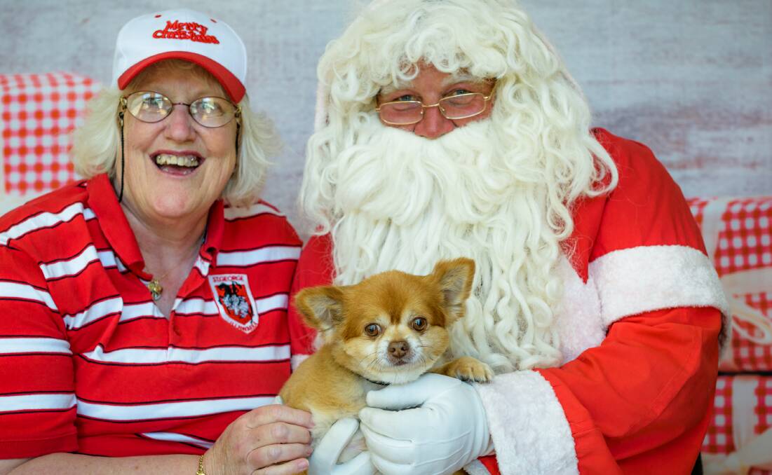 PET PORTRAIT: Tina Bingham and Baxter meet Santa on the weekend. Santa Paws is also being held at Cobargo this Sunday. Book your pet photo on 6493 6897.