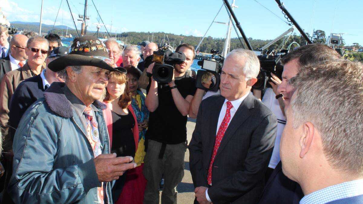 Eden elder Pastor Ossie Cruse speaks to Prime Minister Malcolm Turnbull and NSW Premier Mike Baird during their visit earlier this year.