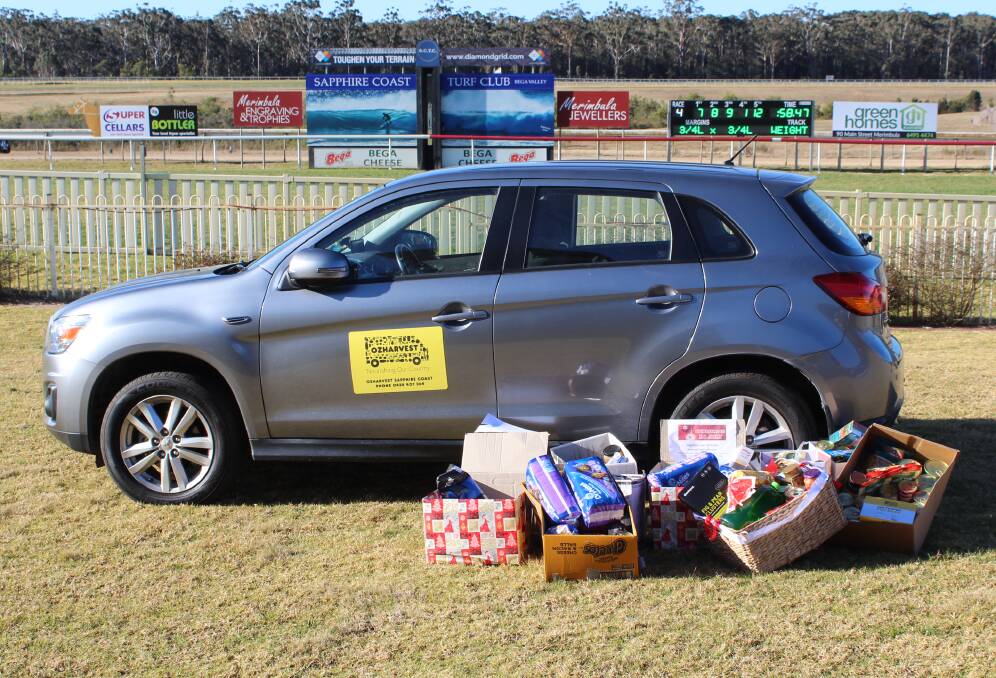 HELPING HAMPERS: Over 110kg of food was donated to OzHarvest Sapphire Coast through the can drive that culminated with a presentation at the Eden Cup race day.