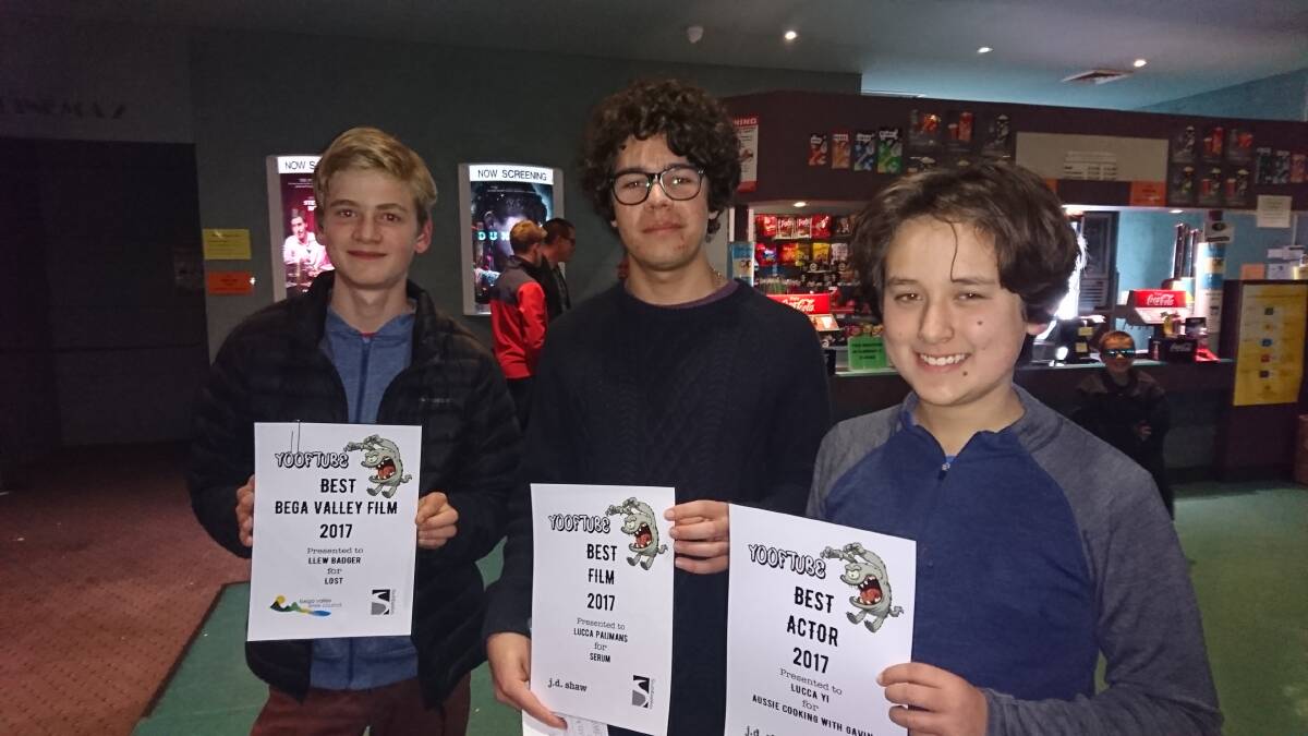 Llew Badger of Bega, Lucca Paijmans of Tathra, Luca Yi of Bega hold up their awards after the screening of the YOOFTube finalists at the Picture Show Man in Merimbula. Photo: Kate Howarth. 