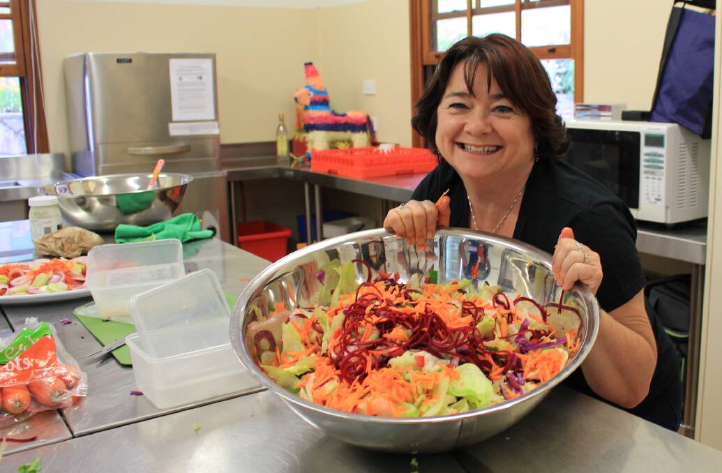 It was all action in the kitchen as Caroline Winnel prepared huge bowls of salad for the Nethercote Christmas party.