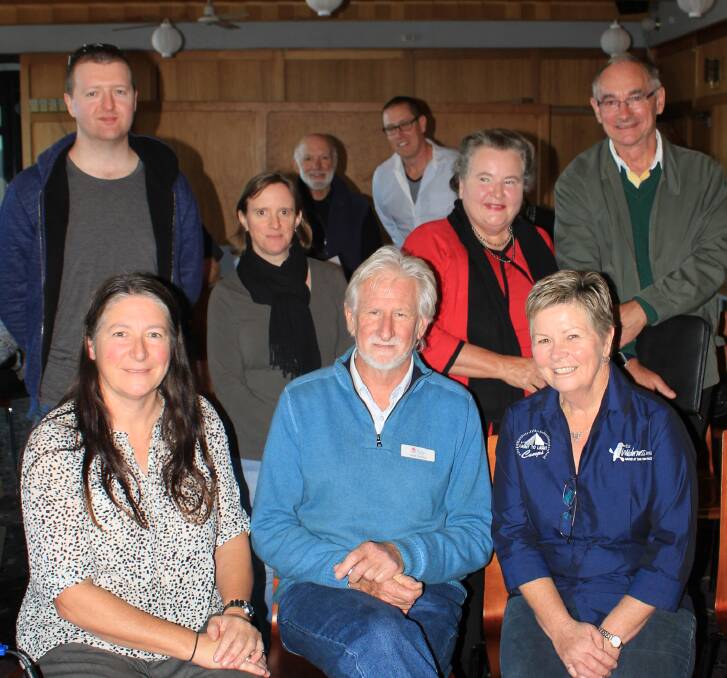 Some of the locals who heard from NSW government solar energy experts Lisa Miller and Mark Fleming (seated) at a seminar in Eden on Wednesday afternoon.