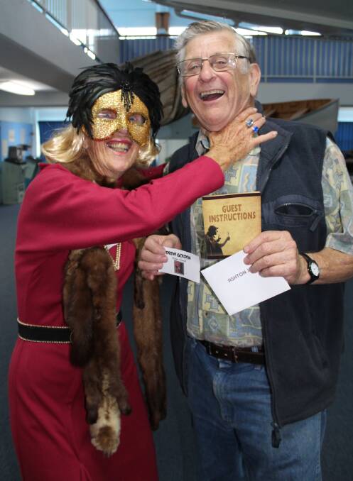 Killer instincts: costumed in fox fur and mask and posing as a theatre director, Margaret Sheaves limbers up for murder with Eden Killer Whale Museum president Jack Dickenson, on Monday May 9. Picture: Toni Houston