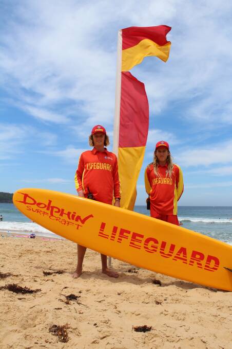 On guard: professional surf lifesavers Morgan Smith and Jake Clarke on patrol on Eden's Aslings Beach, Monday January 11. Photo: Toni Houston