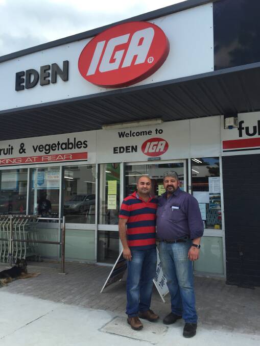 Changing hands: Sandeep Sandeep says hello to Eden community and offers warm farewell to proprietor Con Castrissios as Eden IGA enters a new era, Monday November 23. Photo: Toni Houston