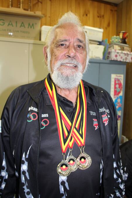 Defending his title: Uncle Ossie Stewart with his Olympic medals from last year's Koori Olympics in Albury. Picture: Toni Houston