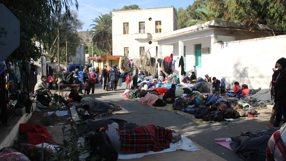 STRUGGLE: Refugees sleep on cardboard or the ground as they camp in Leros. 