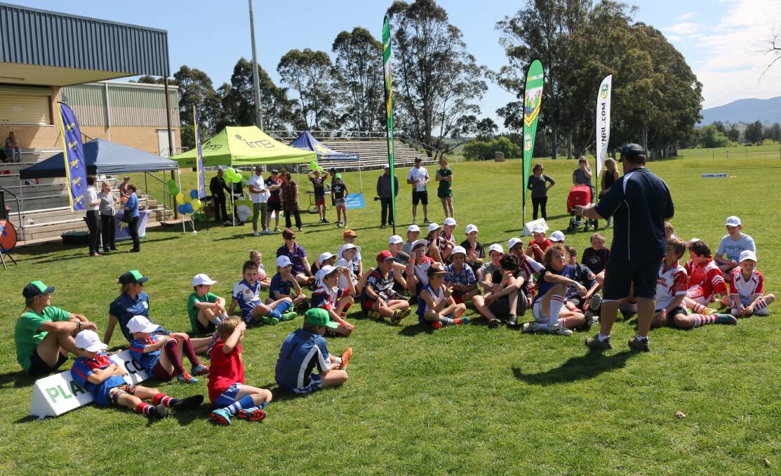 Briefing: Entrants of the Bega footy camp listen intently to development officer and coach Damian Kennedy on Tuesday. Pictures: Jacob McMaster.