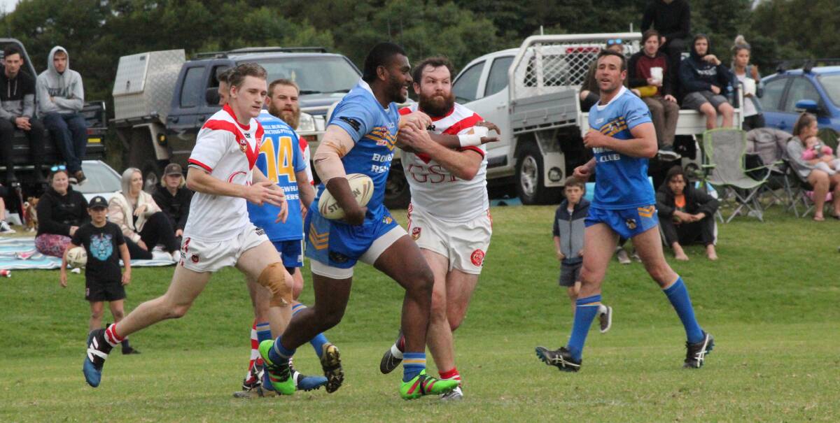 Tough tackle: Eden Tiger Greg Nicholson gets to grips with one of the Bombala Blue Heelers' Fijian strongmen during Sunday's game. 