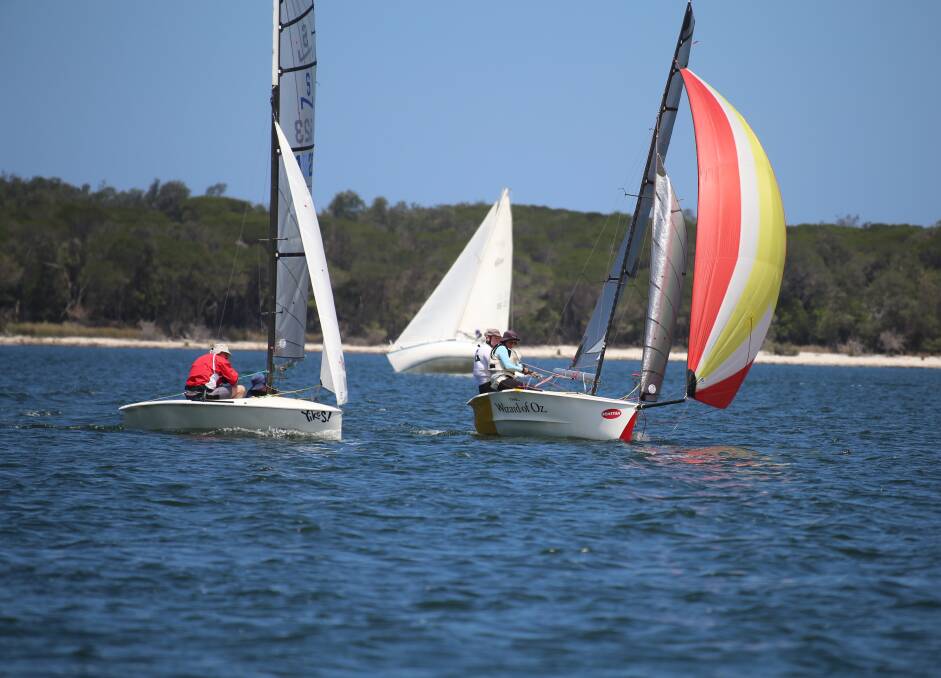 Neck and neck: Josh and Jarrah Dorrough go head to head with Rob and Sian Morton during race one at Wallagoot Lake on Saturday. 