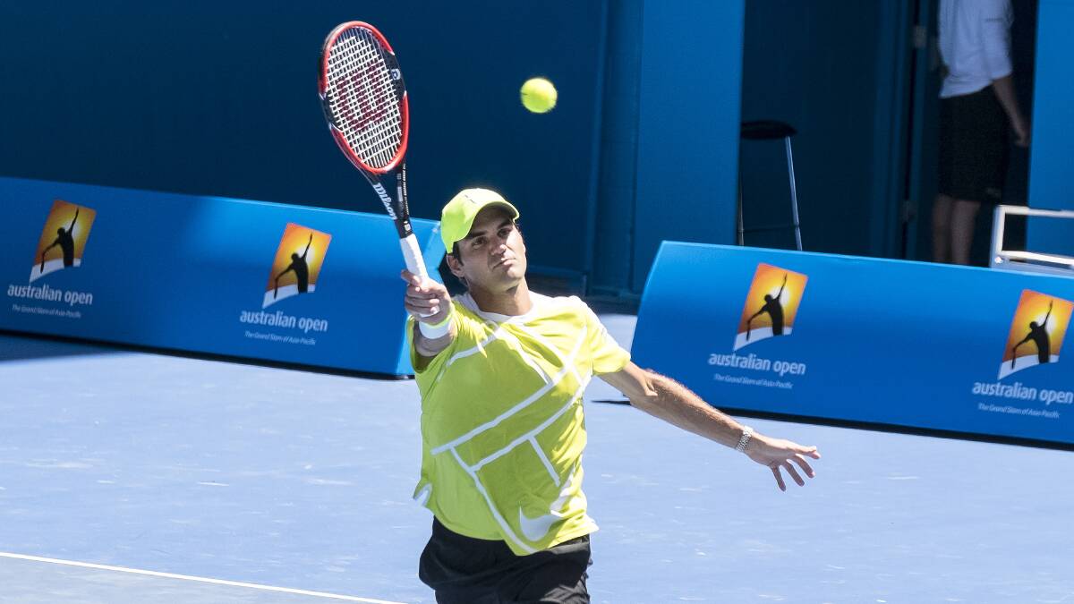 Record setter: Roger Federer enjoys a practice during the Australian Open and has just won his eighth Wimbledon title. 