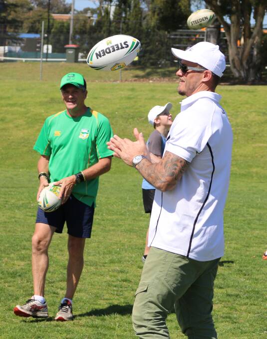 Coaching: Bernie Maher and Matt Cooper show a skills lesson on Tuesday. 