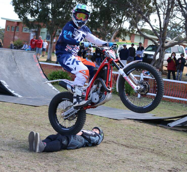 Tricky situation: Jake Field narrowly hops over BMX stuntman Josh Williams as part of the Flair Action Sports show on the weekend. 