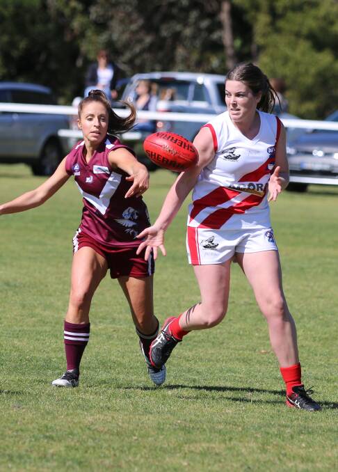 Eden and Tathra challenge for midfield control in the grand final. 
