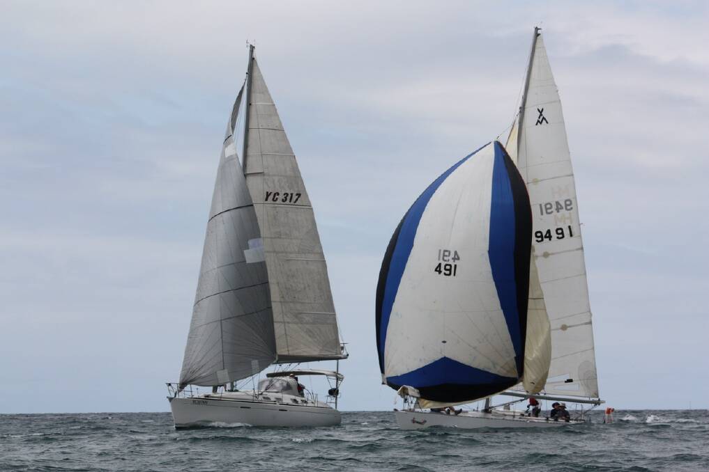 Final dash: ‘Go Go' puts the spinnaker up and challenges and passes 'Back Friday’ to win a race overall during a recent meet. Picture: Aleksandar Konjevic