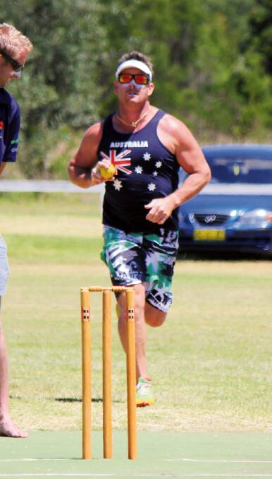 Cricket in the sun: Mark Spink winds up to bowl during a previous Australia Day Challenge.  Good numbers are expected next Thursday. 
