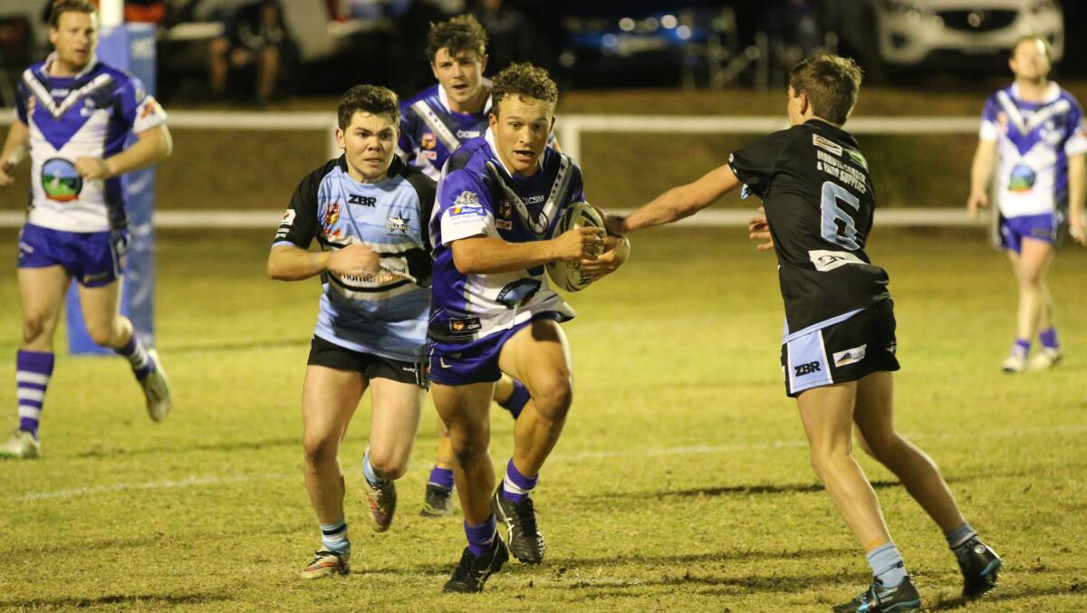Line-break: Aaron Proctor makes a burst through the Moruya line during a gritty 28-20 win in the reserve grade fixture on Saturday night. 