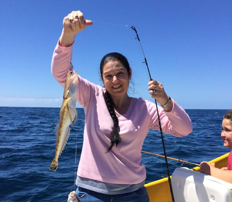 In the pink: Linda Robinson from Geelong shows us how to fish during the Tathra Amateur Fishing Club’s Australia Day Competition last Sunday.