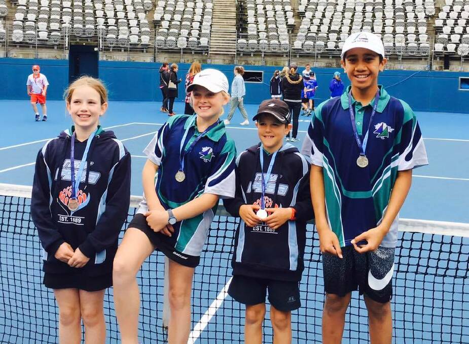 Finalists: The Merimbula Public School's young tennis stars Mackenzie Morse, Hollie Staight, Luka Cowles and Maka Ofati with their runner-up medallions. 