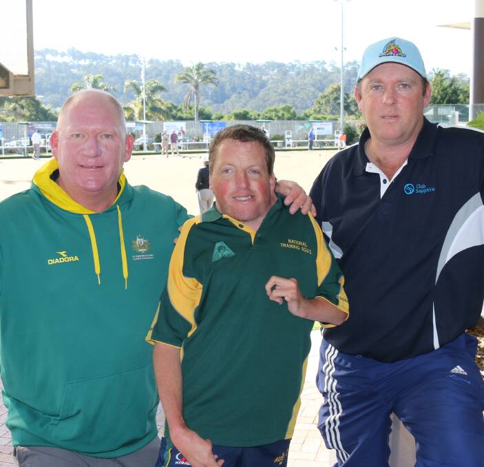 Rolling on: Australian bowling coach Steve Glasson, James Reynolds and Michael Wilks. Wilks and Reynolds are backing a proposal to upgrade Merimbula greens to synthetics. Picture: Jacob McMaster