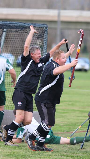 Elation: Stewart Smith throws up a cheer after scoring "his first goal in five years" during the hockey grand final on Saturday. 