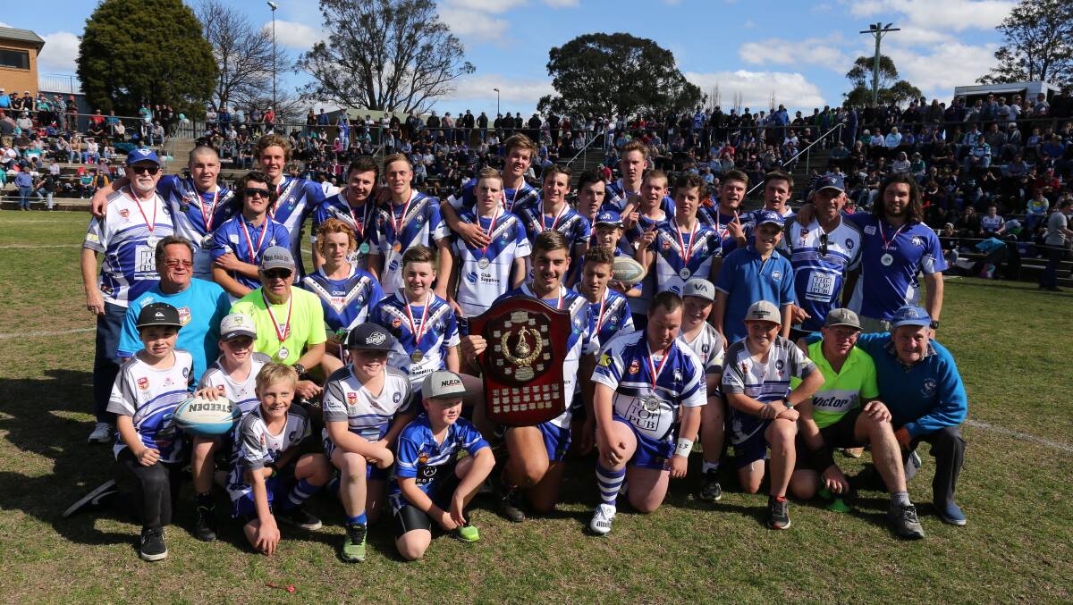 Victorious: The Merimbula-Pambula Bulldogs celebrate an undefeated under 18s season winning the premiership. 