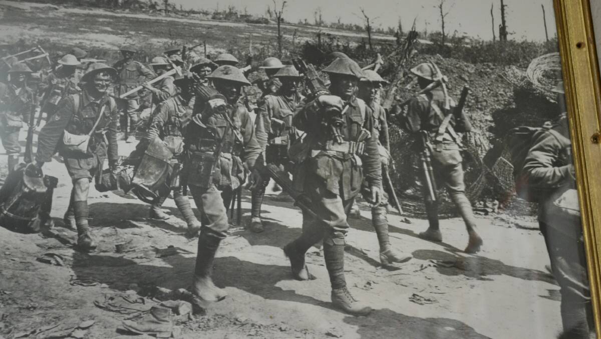 Nowra RSL member Bob Brown's father Sergeant Horace Brown (front) carries a machine gun out of Pozières with the 2/19 Machine Gun Battalion.