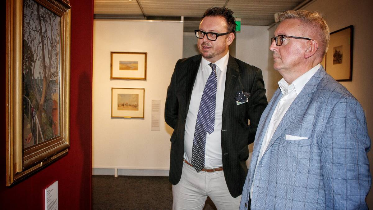 STATE OF THE ARTS: Arts minister Don Harwin and regional galley director Iain Dawson ponder a work by Adrian Feint. Picture: Alasdair McDonald