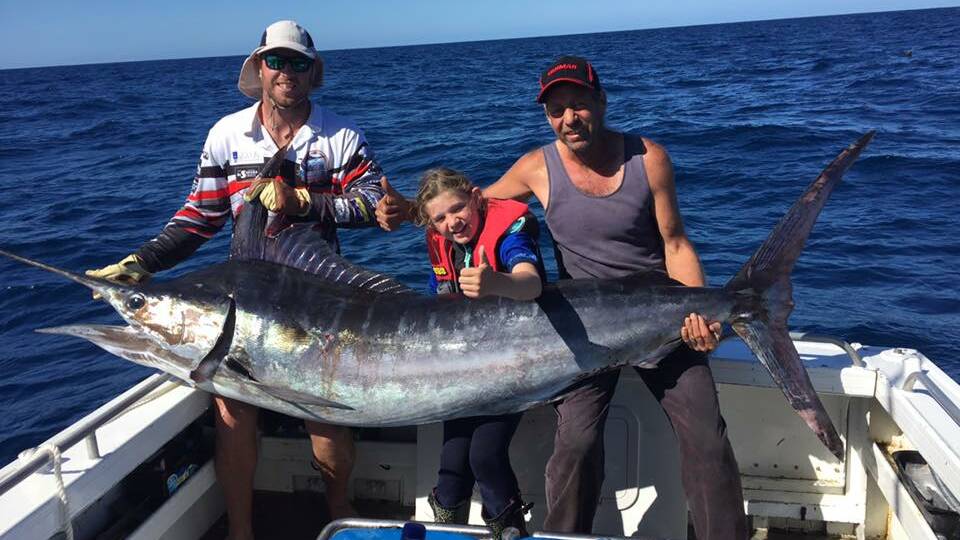 GAME ON: Anglers will be hoping for a decent catch at this weekend's Eden Open Tournament. Kaitlyn Schofield, 10, caught this 102kg striped marlin out of Eden in February. Image: Eden Game Fishing Club.
