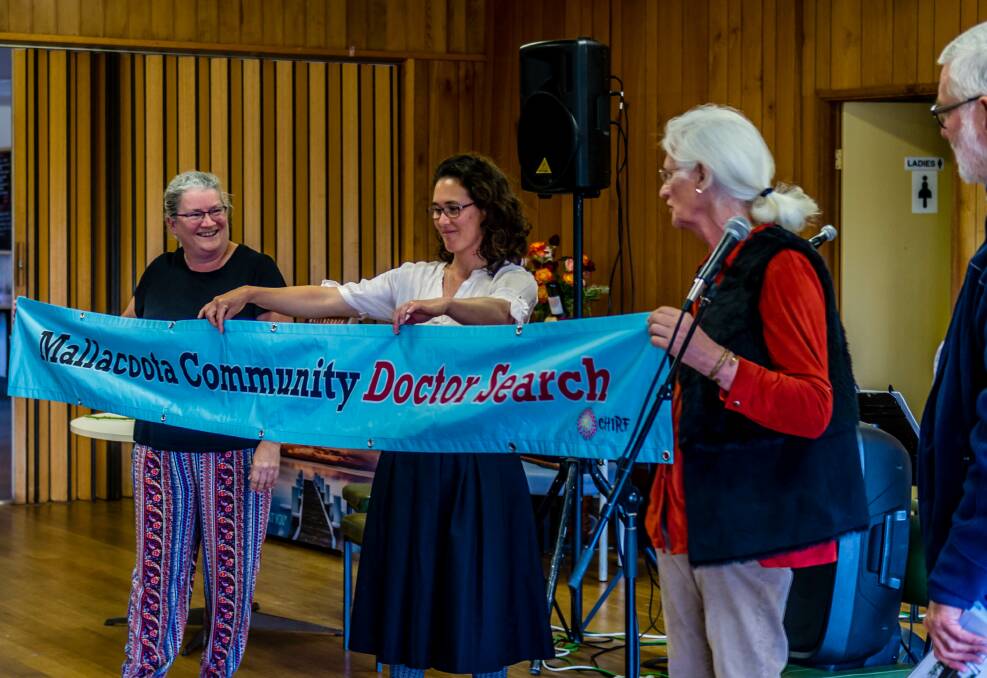 DOCTOR DOCTOR: Dr Tricia Hiley and Dr Sara Renwick-Lau show off the Mallacoota Community Doctor Search banner. Photo: Supplied.