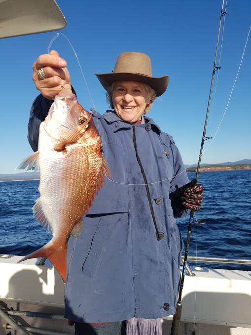 Fish dinner: Linda Miller shows her lovely snapper taken off Long Point while fishing from local charter boat Rathlin II. 