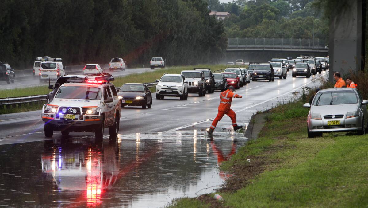 Flooding on the Princes Highway at the Fowlers Road exit on Saturday afternoon. Photo: Georgia Matts