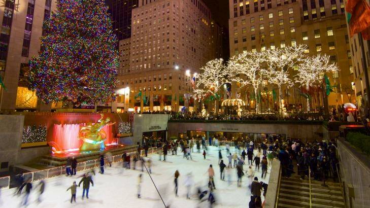 Tourists and skaters get in the Christmas spirit at New York's Rockefeller Centre.  Photo: iStock