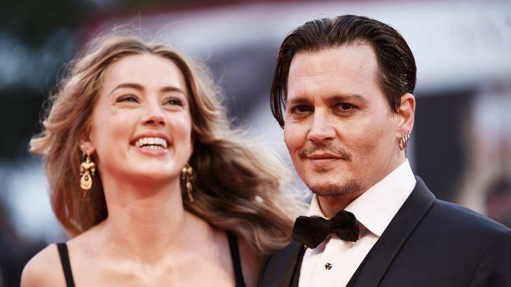 In happier times: Amber Heard and Johnny Depp.  Photo: Ian Gavan