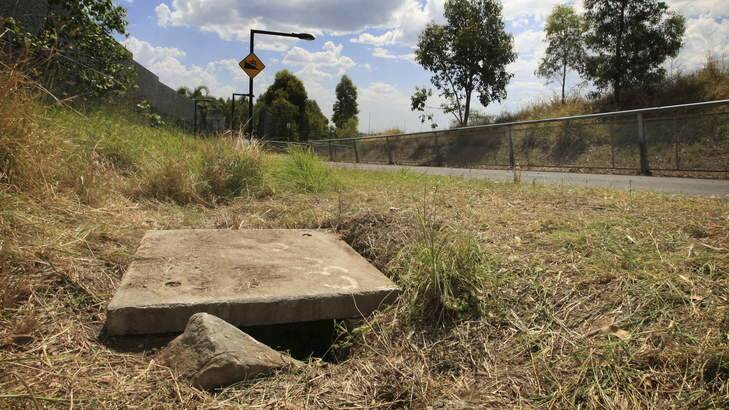 The drain beside the M7 where the baby was found. It took seven people to remove the cover. Photo: James Alcock