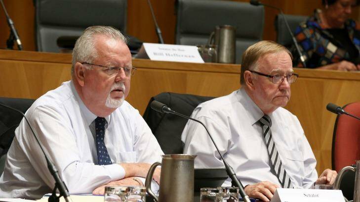 Senators Barry O'Sullivan and Ian Macdonald during the hearing. Photo: Alex Ellinghausen