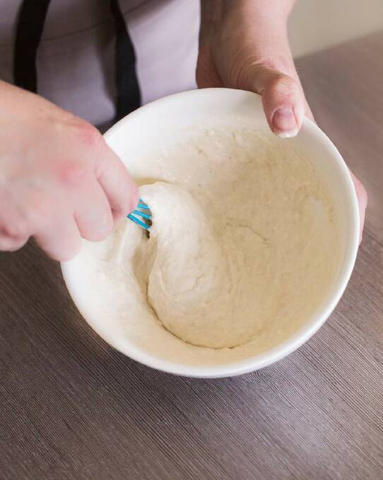 STEP 7: Preheat the oven to 200C. While the buns are rising, make the cross paste by putting the flour in a small bowl with 1/2 cup water and stirring until smooth. Photo: Tamara West