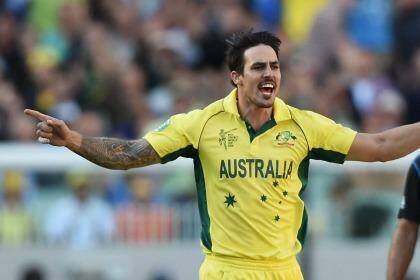 Australia's Mitchell Johnson celebrates the dismissal of New Zealand's Daniel Vettori during the World Cup final at the MCG on Sunday.  Photo: Andy Brownbill