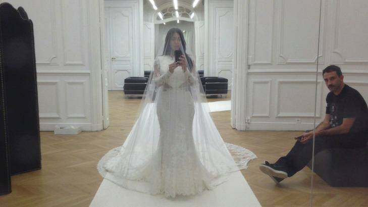 Kardashian trying on her wedding dress before tying the knot with Kanye West in May, 2014. Photo: Kim Kardashian West: Selfish